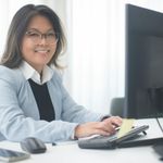 Portrait of a smiling woman, testimonial provider.
